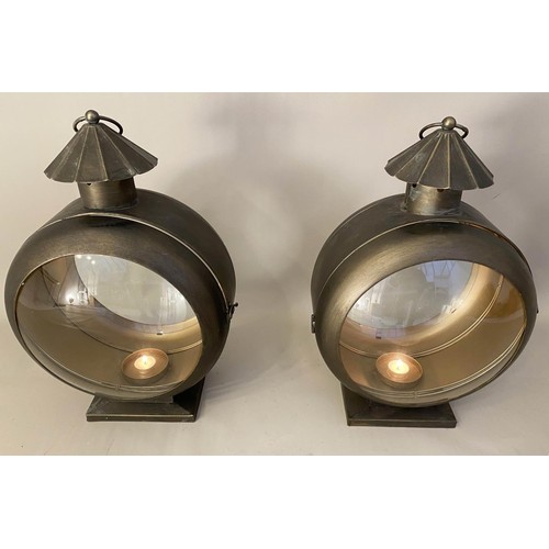 413 - STORM LANTERNS, a pair, convex glass, bronzed metal, 54cm x 37cm x 26cm. (2)