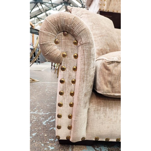 385 - SOFA , sand coloured fabric upholstery, gilt metal studded detail, 235cm W approx.