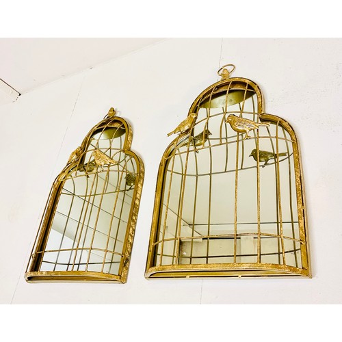 342 - WALL MIRRORS, 57cm high, 35cm wide, a pair, caged gilt metal frame with bird detail. (2)