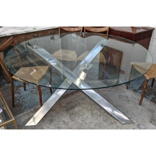 469 - DINING TABLE, glass top on polished metal base4 170cm diam x 77cm.