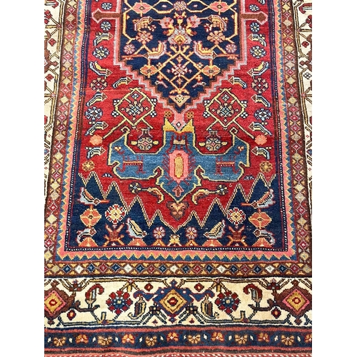 108 - ANTIQUE NORTHWEST PERSIAN RUG, 215cm x 128cm.