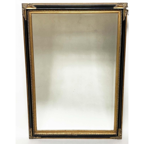 116 - WALL MIRROR, Italian style rectangular bevelled mirror with moulded black frame and gilt moulded cor... 