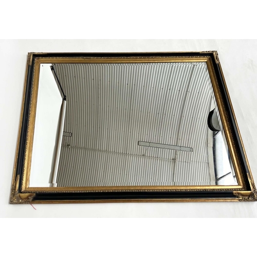 116 - WALL MIRROR, Italian style rectangular bevelled mirror with moulded black frame and gilt moulded cor... 