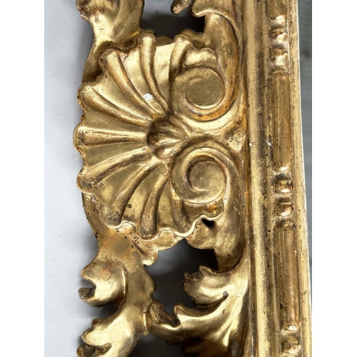 125 - FLORENTINE WALL MIRROR, late 19th/early 20th century Florentine carved giltwood, 90cm H x 74cm W.