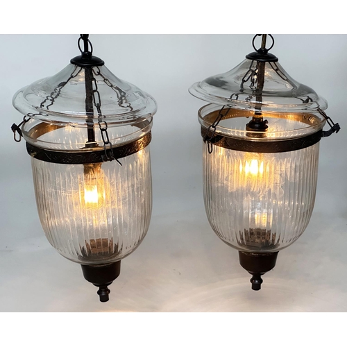 129 - BELL JAR HALL LANTERNS, a pair, glass reeded tapering and bronze style mounted, 58cm H x 34cm. (2)