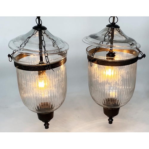 129 - BELL JAR HALL LANTERNS, a pair, glass reeded tapering and bronze style mounted, 58cm H x 34cm. (2)