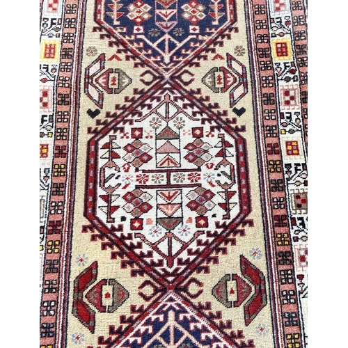 88 - ANTIQUE SERAPI RUNNER, 290cm x 72cm.