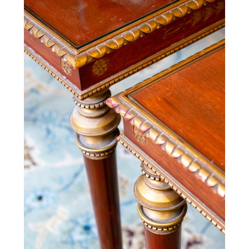 154 - LOW TABLES, a pair, Brazilian mahogany with gilt detail and inset glass tops, each 42cm x 62cm x 58c... 