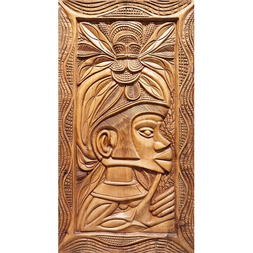 8 - PEPE ADRAS, South American carved panel depicting figure with headdress, 77cm H x 42cm.