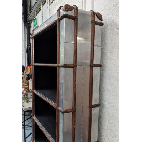 447 - BOOKCASE, aviator style design, four shelves, with bottom lifting up to reveal hidden storage, 110cm... 