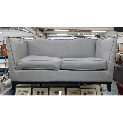 434 - SOFA, two seater, contemporary, grey upholstered, studded frame, with two loose back cushions, shape... 