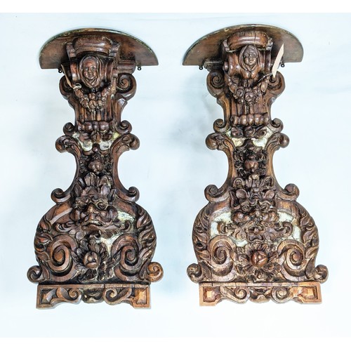 17 - WALL MOUNTED BRACKETS, a pair, hand carved in the Rococo style, with plinth tops supported by scroll... 