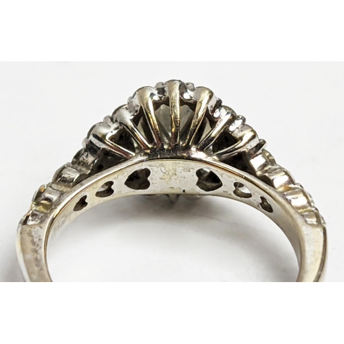 1 - A WHITE METAL DIAMOND SET DRESS RING, probably 18ct white gold, the large round brilliant cut centra... 