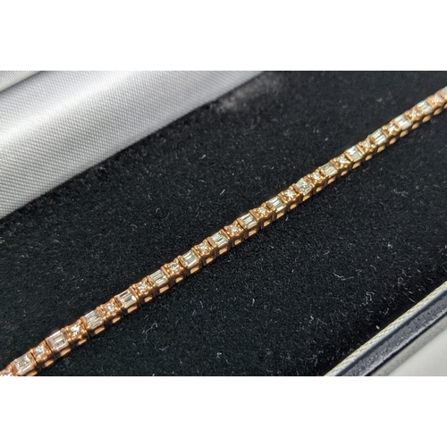 38 - A 10CT ROSE GOLD AND DIAMOND SET BRACELET, set with alternating baguette and round brilliant cut dia... 