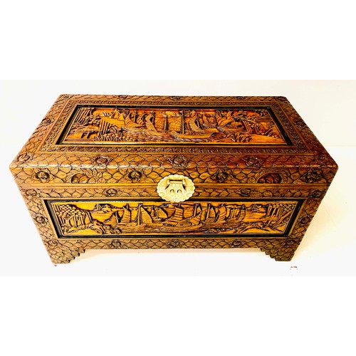 539 - CHINESE CAMPHOR CHEST, 46cm high, 88cm wide, 43cm deep, early 20th Century, carved panels depicting ... 