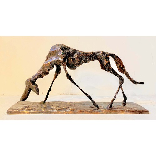 540 - FIGURE OF A DOG, BRONZE, abstract form, in standing position, 30cm high, 60cm wide, 12cm deep