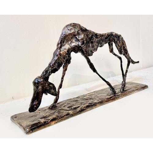 540 - FIGURE OF A DOG, BRONZE, abstract form, in standing position, 30cm high, 60cm wide, 12cm deep