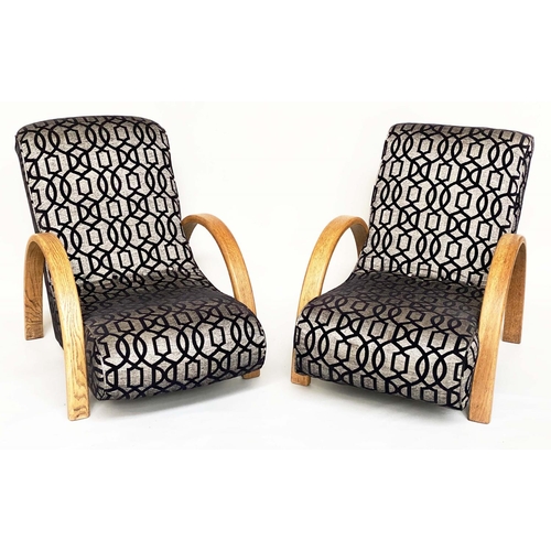 555 - HEAL'S BANANA LOUNGE CHAIRS, a pair, with oak bentwood arms, 76cm W. (2)