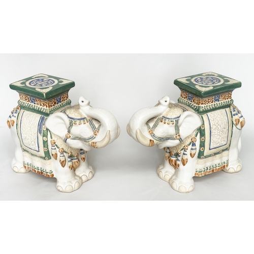 449 - ELEPHANT STOOLS, a pair, Indian ceramic polychrome of elephants in ceremonial regalia with seats, 60... 