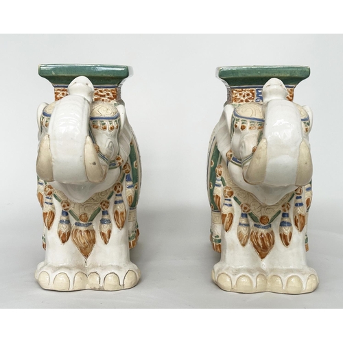 449 - ELEPHANT STOOLS, a pair, Indian ceramic polychrome of elephants in ceremonial regalia with seats, 60... 