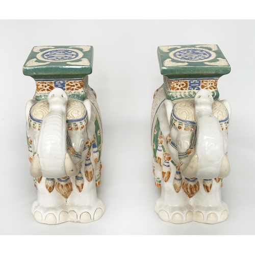 449 - ELEPHANT STOOLS, a pair, Indian ceramic polychrome of elephants in ceremonial regalia with seats, 60... 