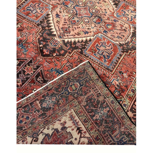 107 - PERSIAN HERIZ CARPET, 340cm x 245cm.