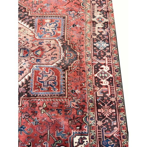 107 - PERSIAN HERIZ CARPET, 340cm x 245cm.