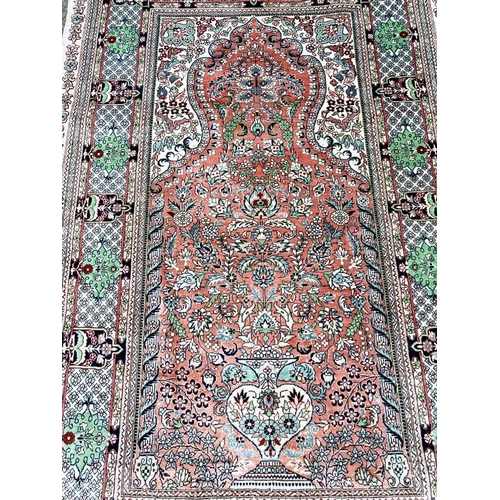 109 - FINE PURE SILK HEREKE DESIGN RUG, 130cm x 80cm.