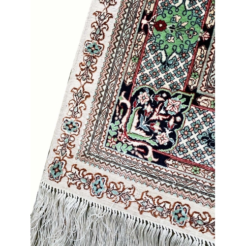 109 - FINE PURE SILK HEREKE DESIGN RUG, 130cm x 80cm.