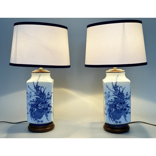 122 - TABLE LAMPS, a pair, Chinese blue and white ceramic on carved stands (with shades), 70cm H. (2)