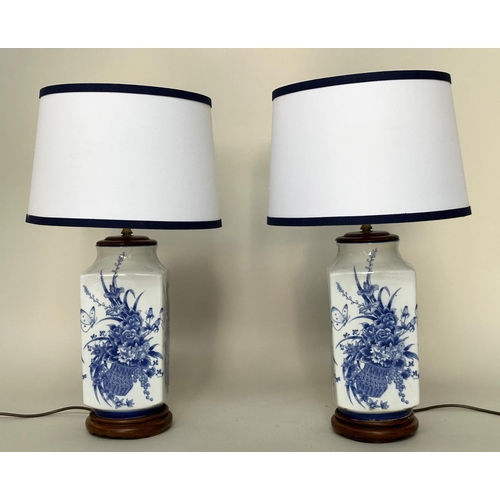 122 - TABLE LAMPS, a pair, Chinese blue and white ceramic on carved stands (with shades), 70cm H. (2)