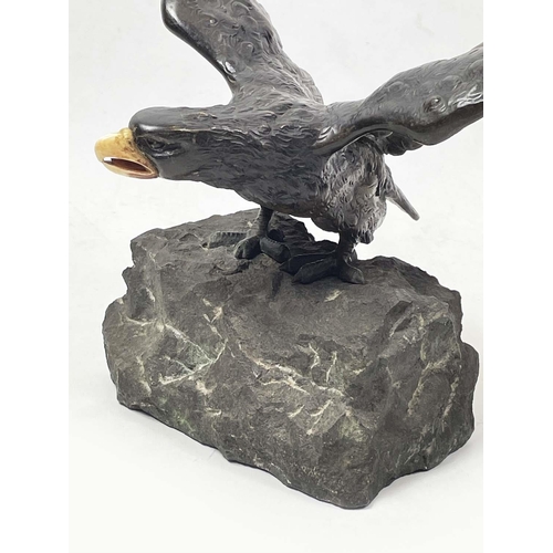 1 - BRONZE EAGLE, Japanese Meiji style, realistically cast perched on rock about to take flight, 40cm W ... 