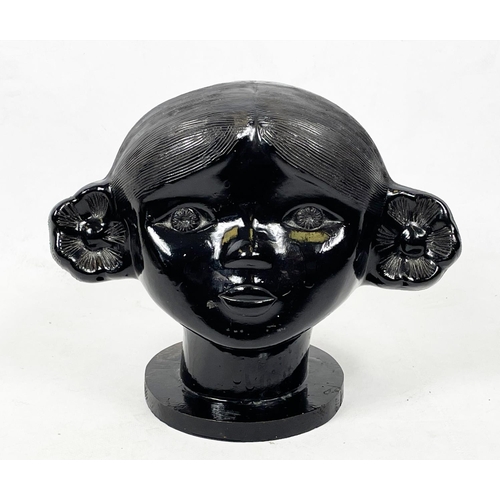 17 - USSR BUST OF A GIRL, circa 1960s, black painted ceramic on a wooden plinth base, 24cm W x 20cm H.