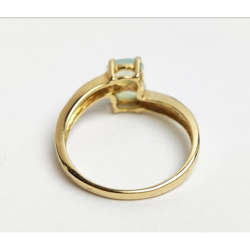 26 - A 9CT GOLD PREHNITE AND NEON APATITE CROSSOVER RING, to the shoulders, ring size P, boxed.