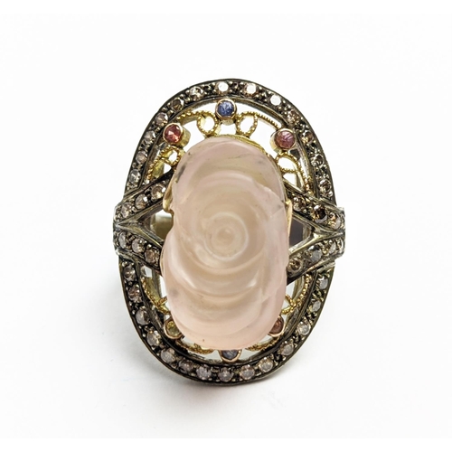 28 - A CARVED ROSE QUARTZ AND DIAMONDS SET DRESS RING, the rose quartz of approximately 12.25ct, the diam... 