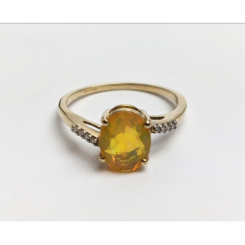 31 - A 9CT GOLD YELLOW OPAL RING WITH DIAMOND-SET TWIST SHOULDERS, the oval cut opal claw set, ring size ... 