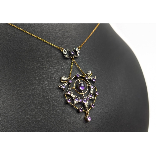 21 - AN EDWARDIAN STYLE SILVER-GILT AMETHYST AND DIAMOND PENDANT NECKLACE, in a spider's web design, 44cm... 