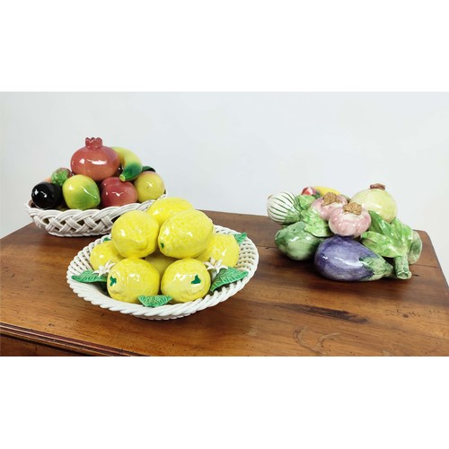 49A - THREE FAIENCE BASKETS OF FRUIT. Includes two ceramic potteries of various fruits and lemons with a p... 