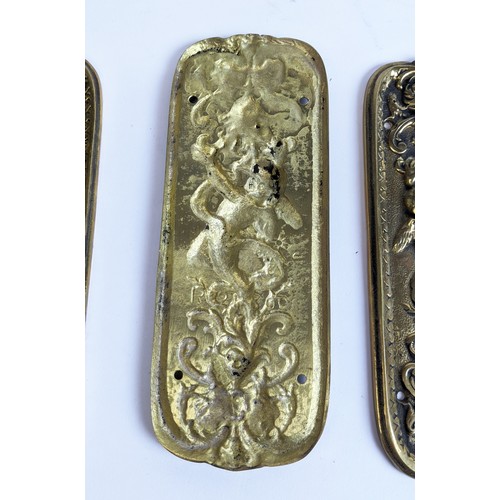 48 - SET OF FOUR BRASS DOOR FINGER PLATES, Art Nouveau style, cast, each depicting a cherub amongst scrol... 