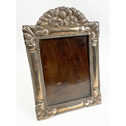 4 - PICTURE FRAMES, a collection of seven mostly silver. (7)