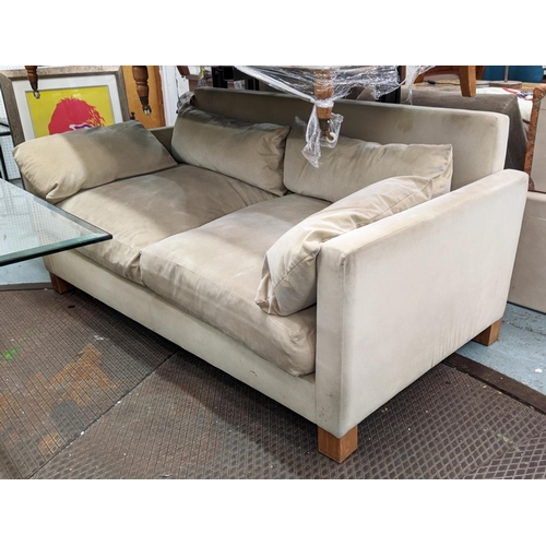 802 - SOFA, with cream suede upholstery on square supports, 183cm W x 83c m H x 96cm H.