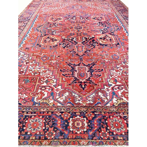 74 - ANTIQUE PERSIAN HERIZ CARPET, 410cm x 299cm.