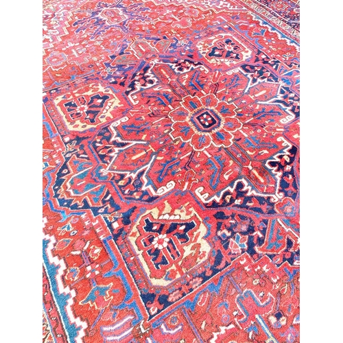 74 - ANTIQUE PERSIAN HERIZ CARPET, 410cm x 299cm.