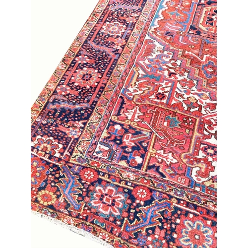 74 - ANTIQUE PERSIAN HERIZ CARPET, 410cm x 299cm.