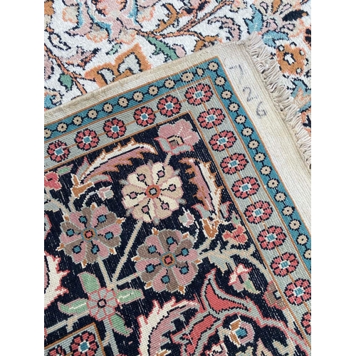 76 - FINE PURE SILK HEREKE DESIGN CARPET, 280cm x 190cm.