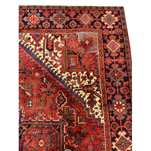 75 - FINE PERSIAN HERIZ CARPET, 327cm x 258cm.