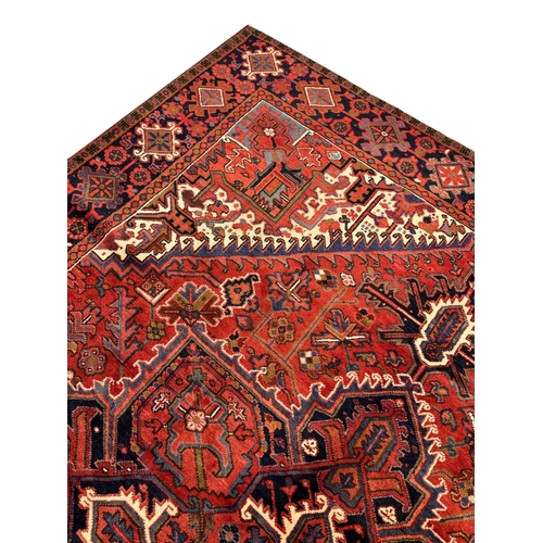 75 - FINE PERSIAN HERIZ CARPET, 327cm x 258cm.