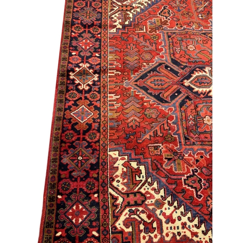 75 - FINE PERSIAN HERIZ CARPET, 327cm x 258cm.