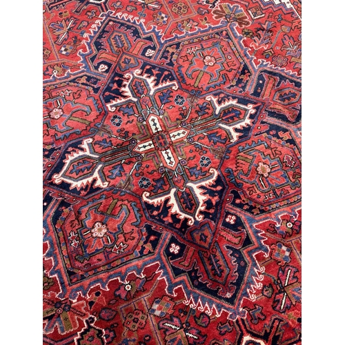 75 - FINE PERSIAN HERIZ CARPET, 327cm x 258cm.