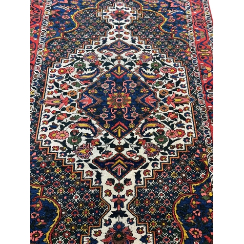 92 - ANTIQUE PERSIAN BAKTIAR RUG, 207cm x 140cm.